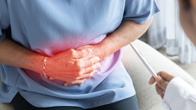 Abdominal pain in elder senior mature aging woman with stomachache illness from stomach cancer, irritable bowel syndrome, Indigestion, Diarrhea or GERD (gastro-esophageal reflux disease)