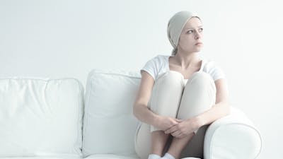 Pensive woman with leukemia looking somewhere without hope