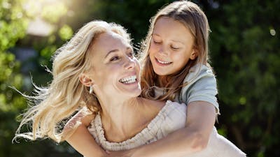 Shot of a woman spending time outdoors with her young daughter.
